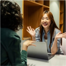 Designer having an enthusiastic mock interview conversation