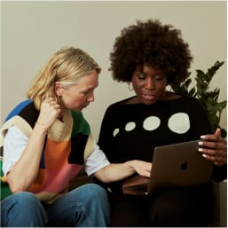 Two designers collaborating on portfolio review