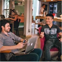 Designers in casual discussion during feedback session
